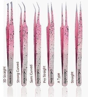 A pink and white set of tweezers with different colors.