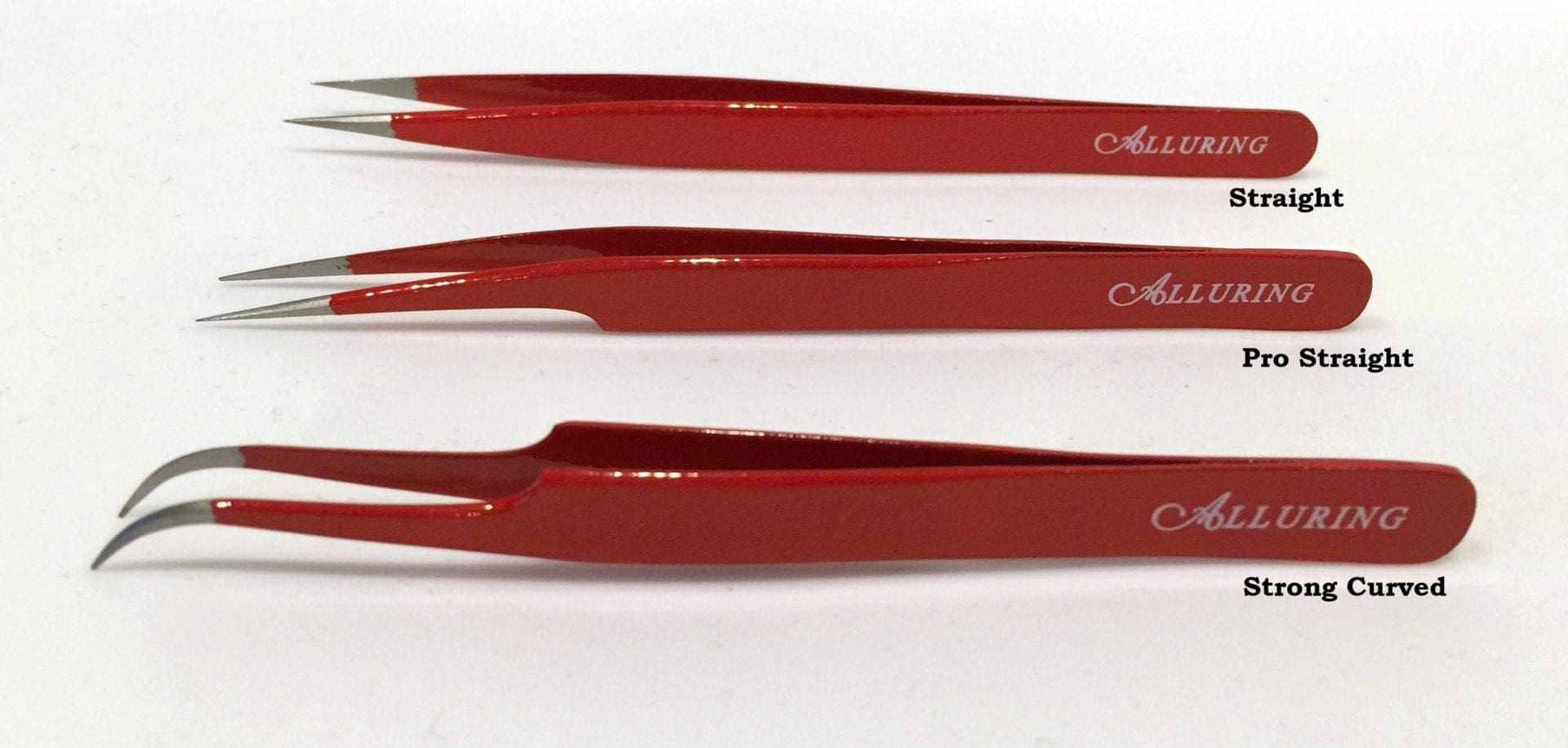 A set of three red tweezers on top of a white surface.