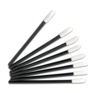 A group of eight black and white toothbrushes.