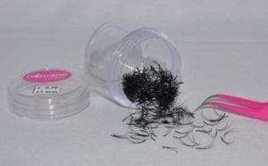 A plastic container with some hair in it