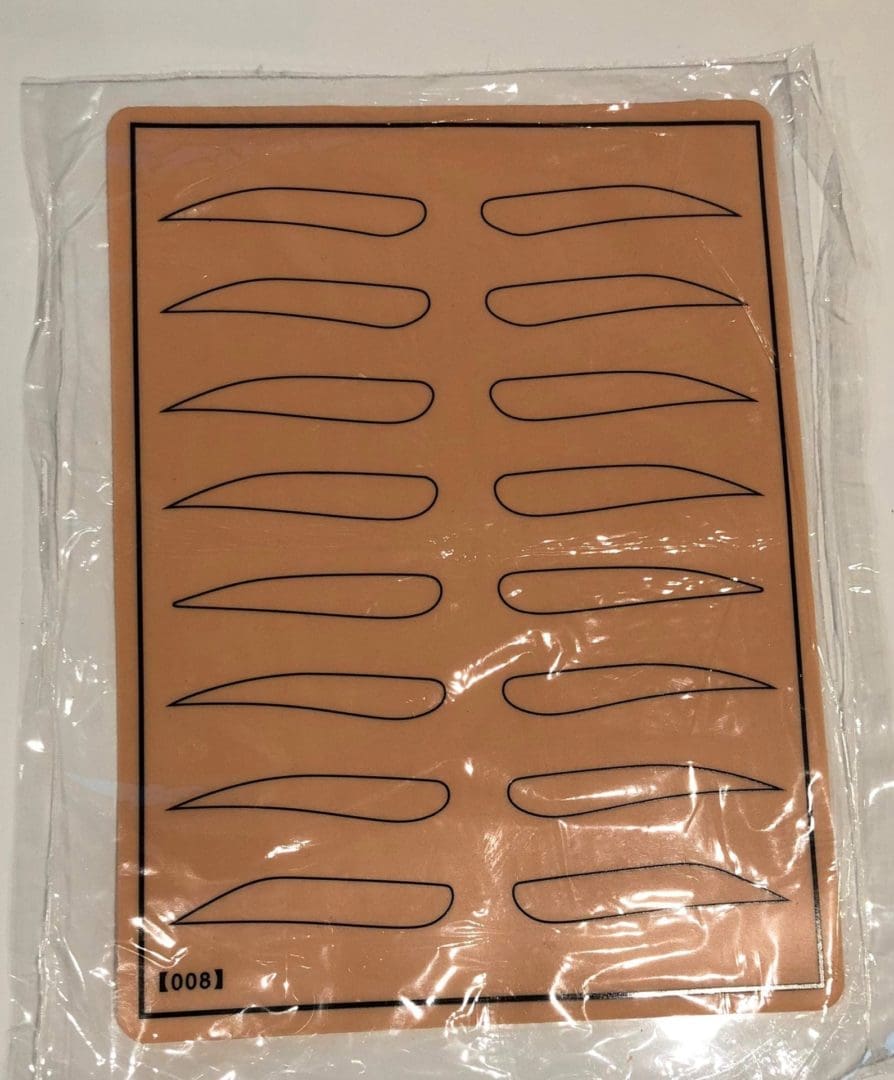 A brown sheet of paper with some black lines on it