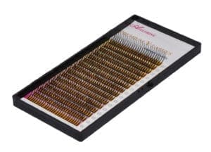 A tray of brown colored lashes in a box.