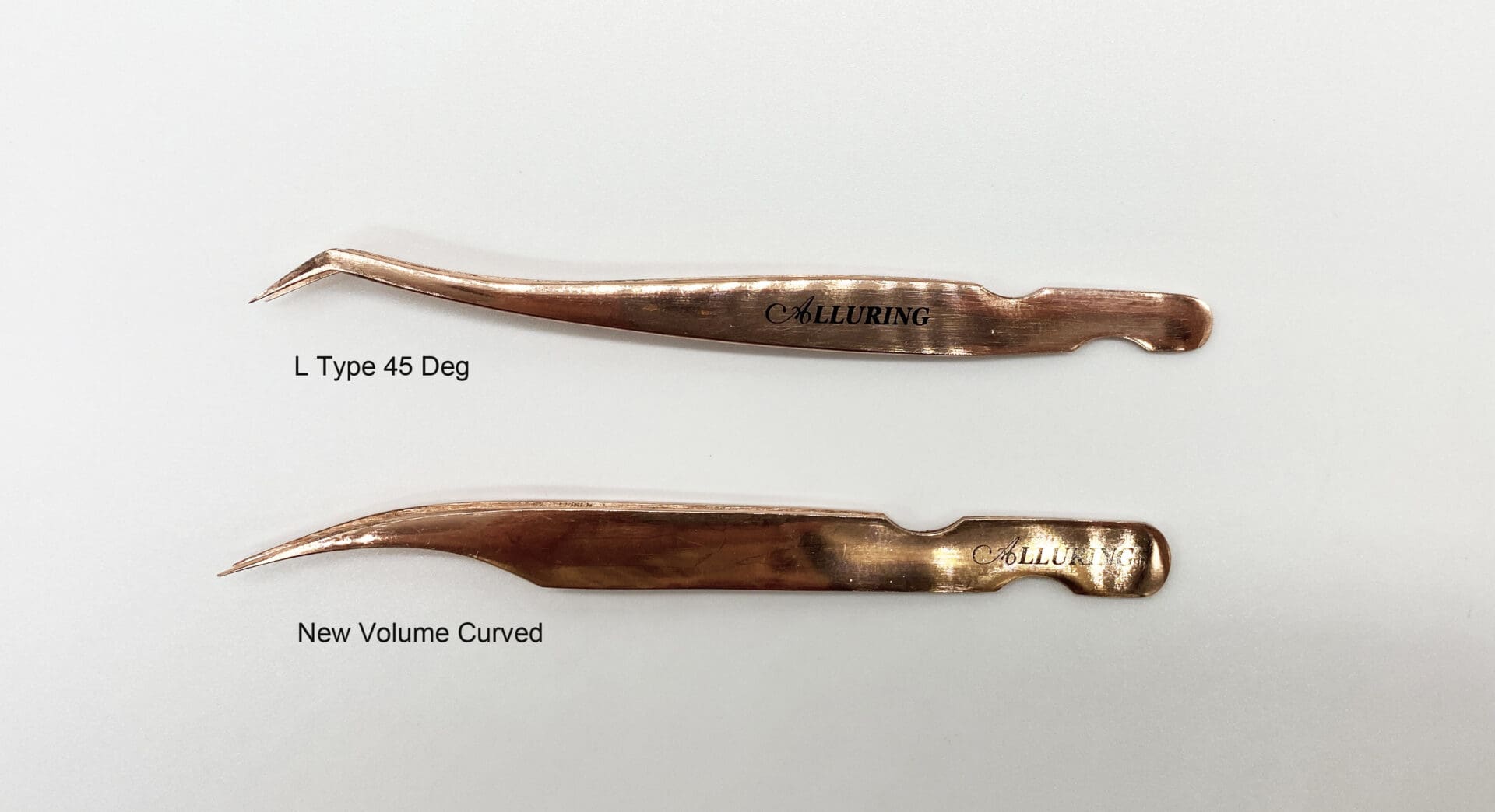 Two rose gold tweezers
