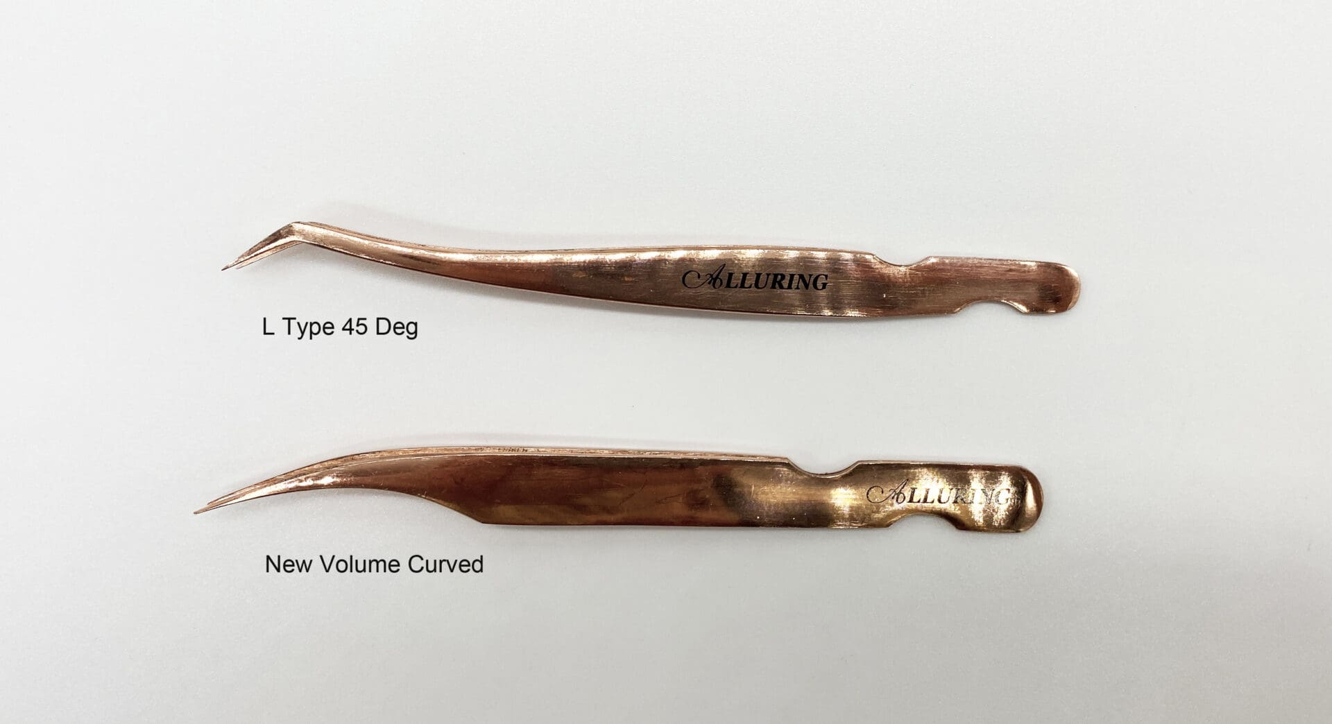 A pair of copper scissors with curved handles.