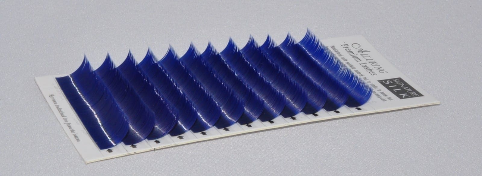 A close up of blue colored individual lashes