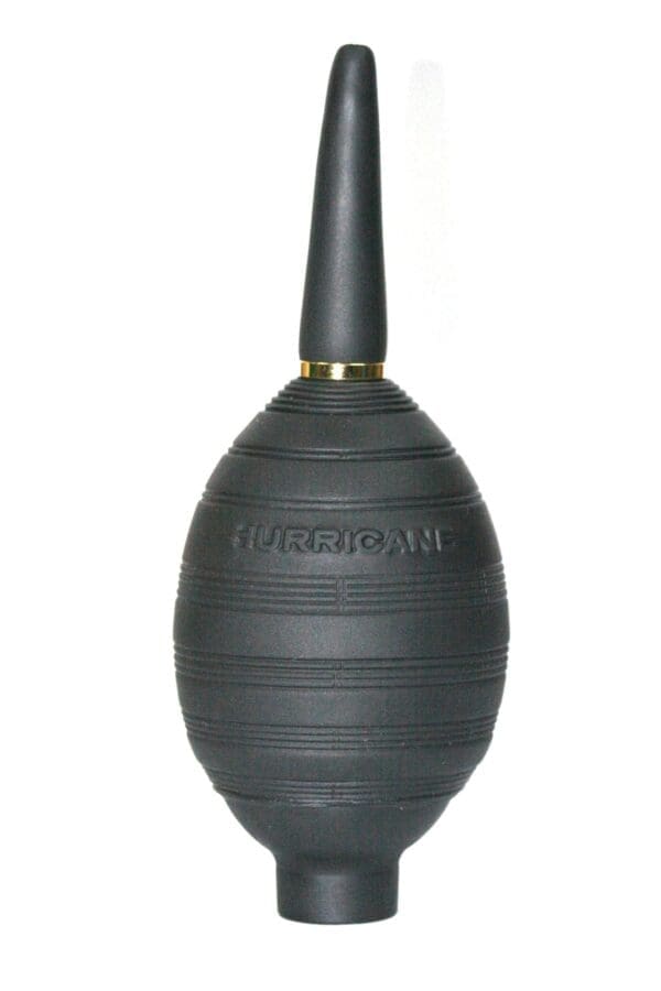 A black vase with gold trim and a handle.