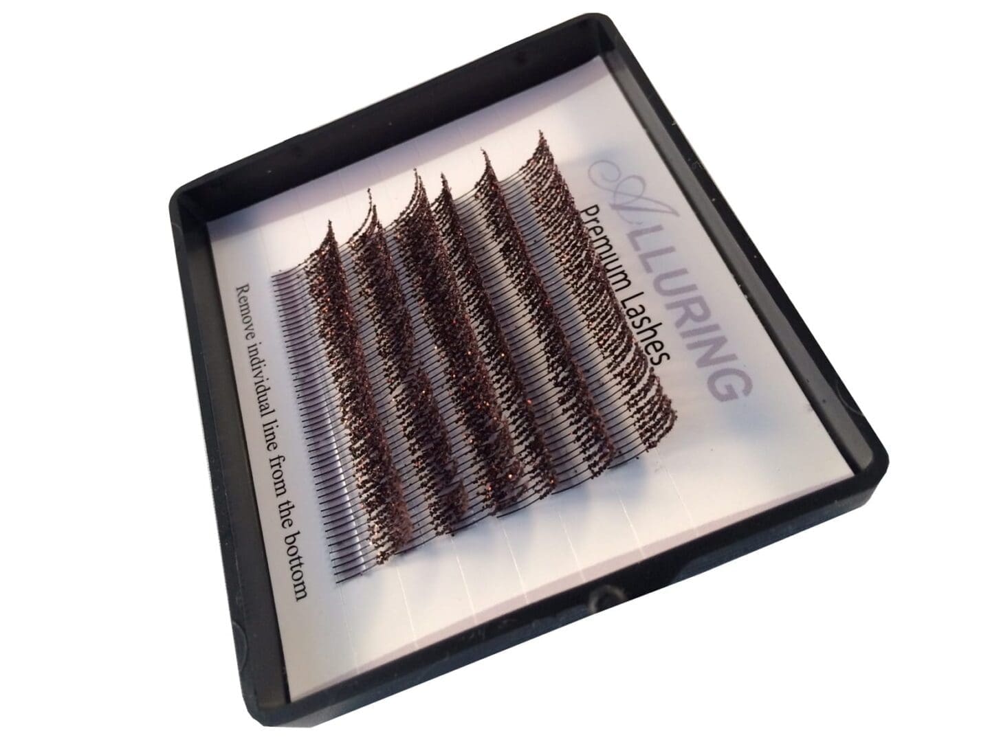 A tray of individual lashes in the middle of each other.