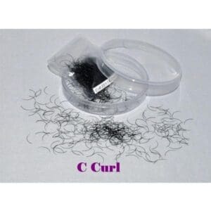 A container of c curl lashes with some smaller curls in it