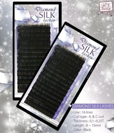 A pair of black silk lashes in packaging.