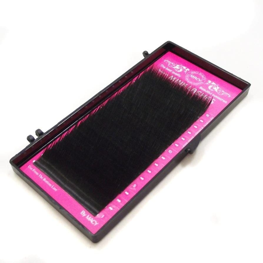A pink tray with black mat and ruler
