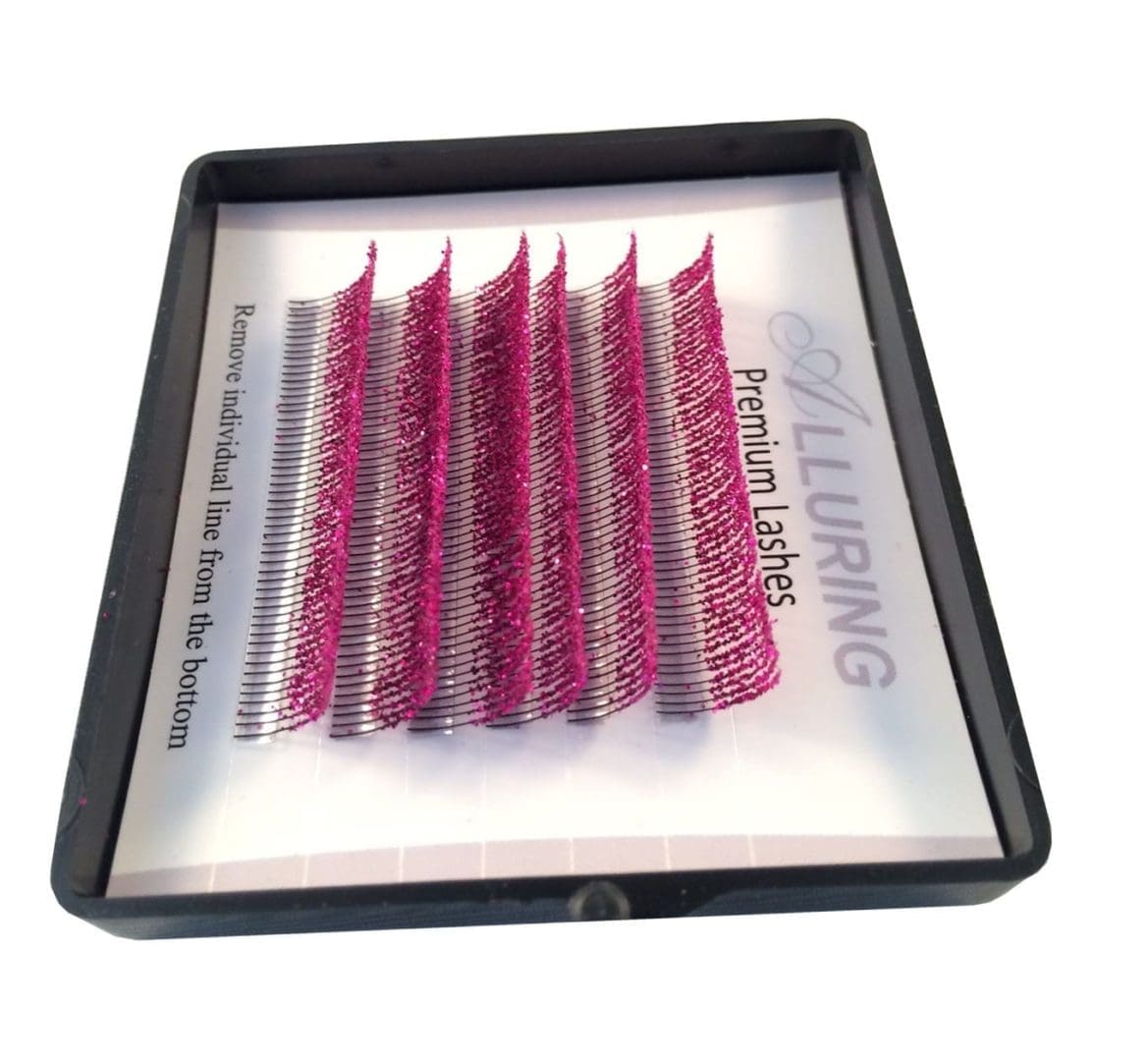 A tray of pink and silver eyelash extensions.