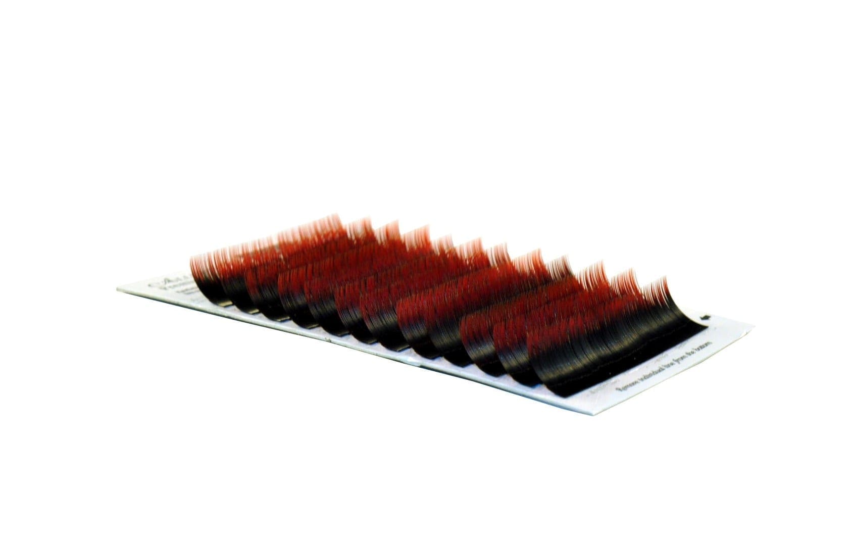 A red and black brush is on top of a white board.