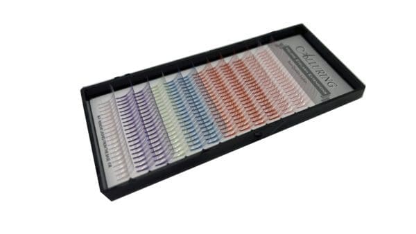 A tray of colored individual lashes in different colors.