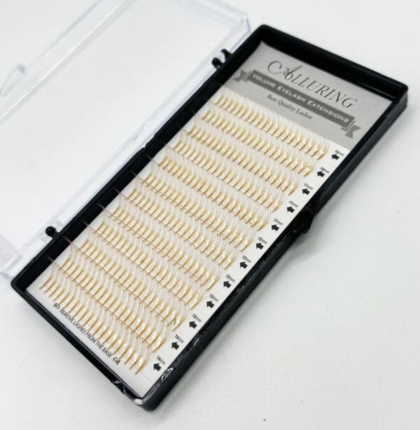 A box of individual lashes in the shape of a heart.