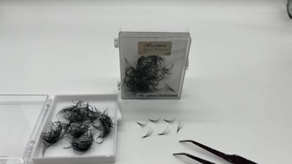 A box of hair with some scissors and other items