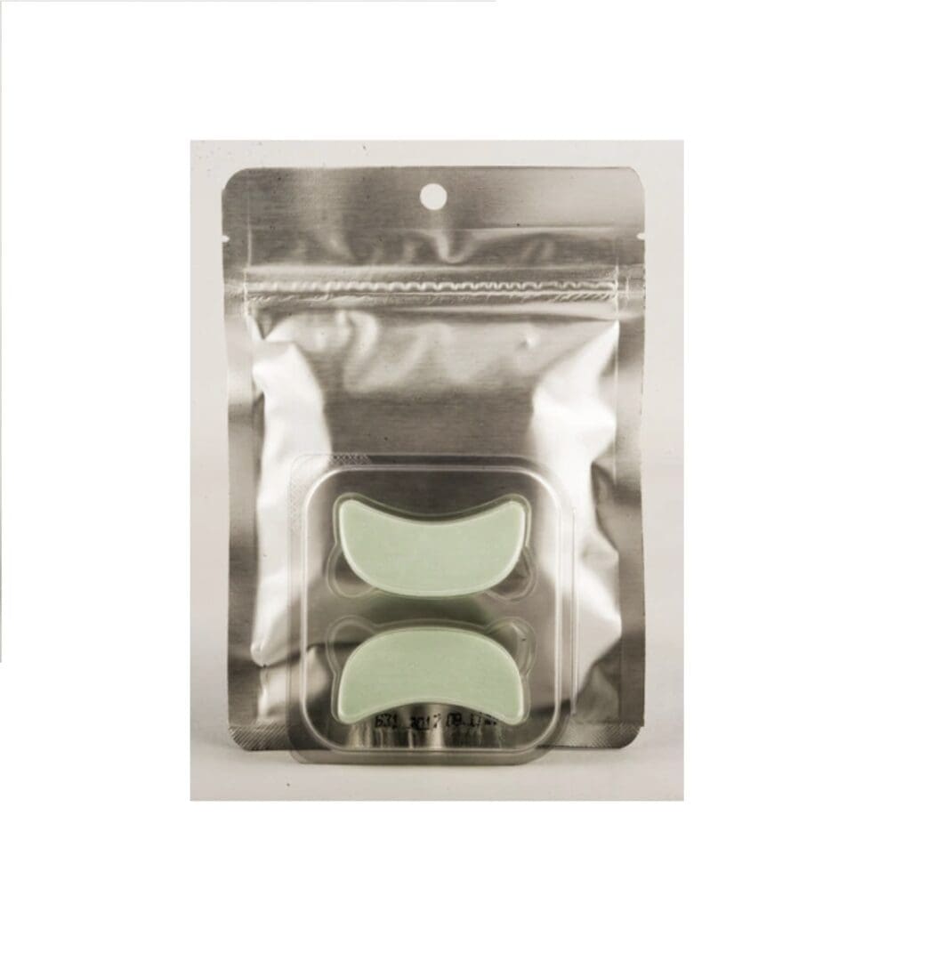 A package of eye shadow in the shape of an arch.