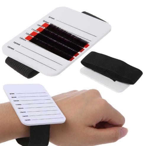 A wrist band that is attached to the side of a hand.
