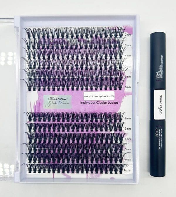 A box of individual lashes with a black pen