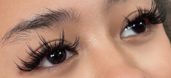 A close up of the eyes with long eyelashes
